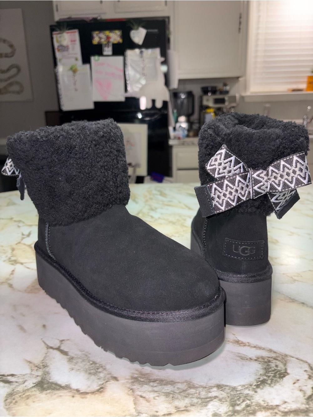 UGG Women's Black Platform Sherpa Ankle Boot with Decorative Bow